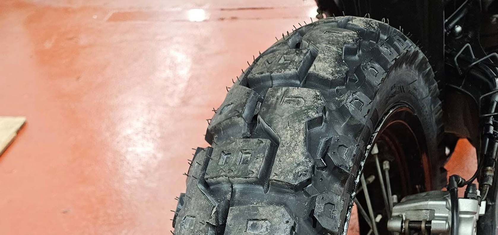 Kingtyre K61 40/60 dual sport tires mounted on ADV bike, front three-quarter view